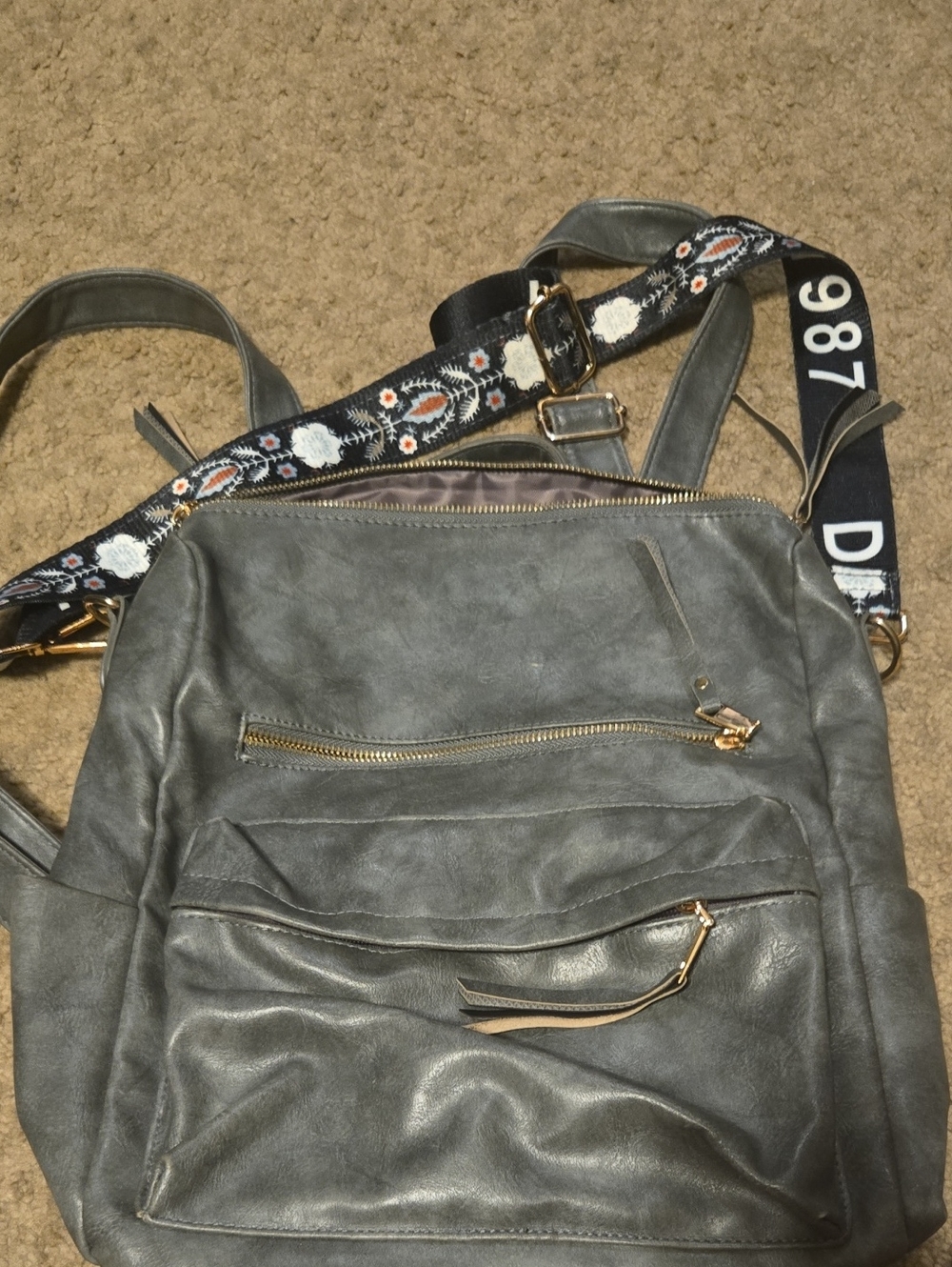 Gray Leather-Look Backpack with Decorative Strap